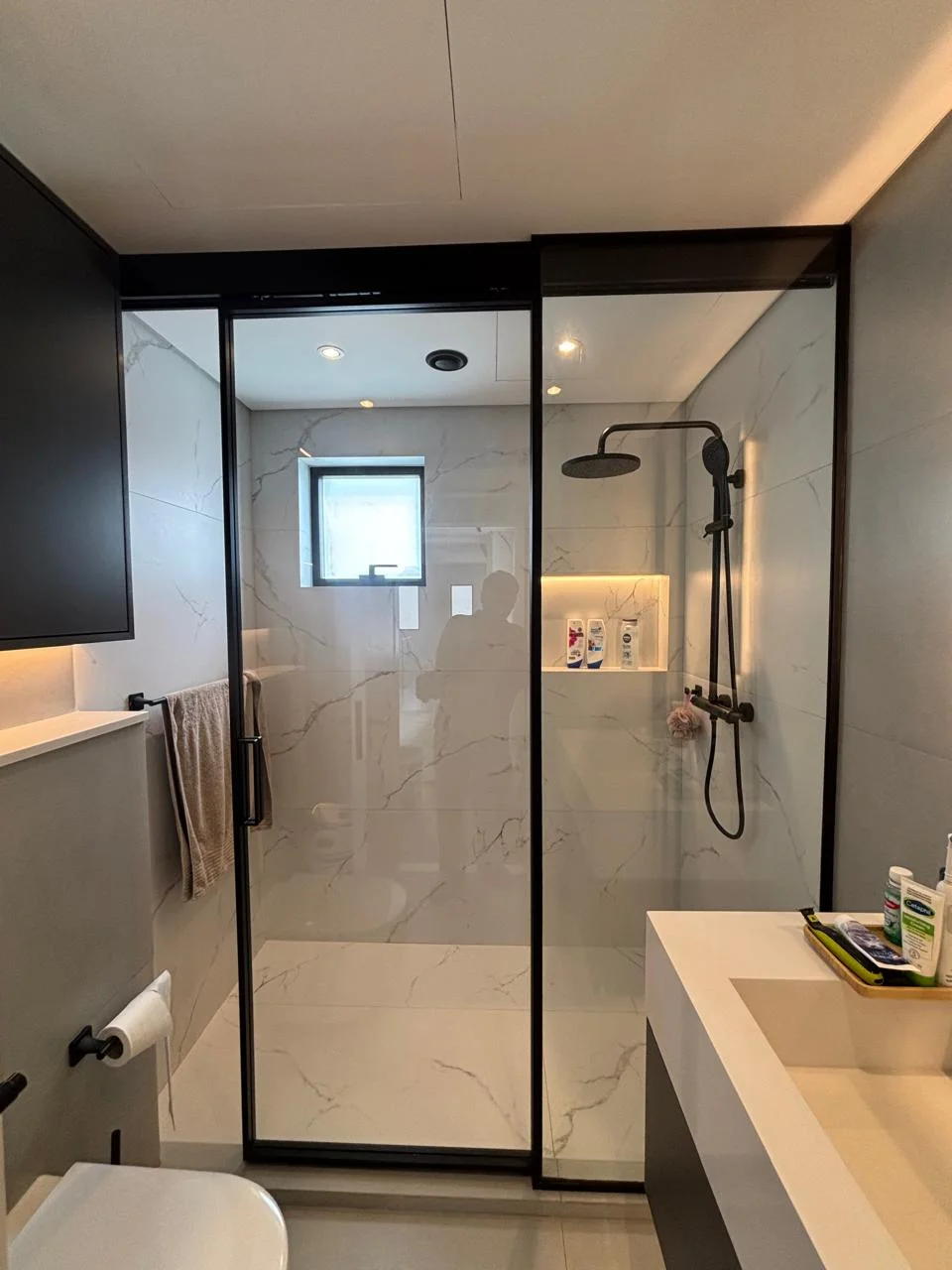 Black framed shower enclosure completed by Crystal Vista