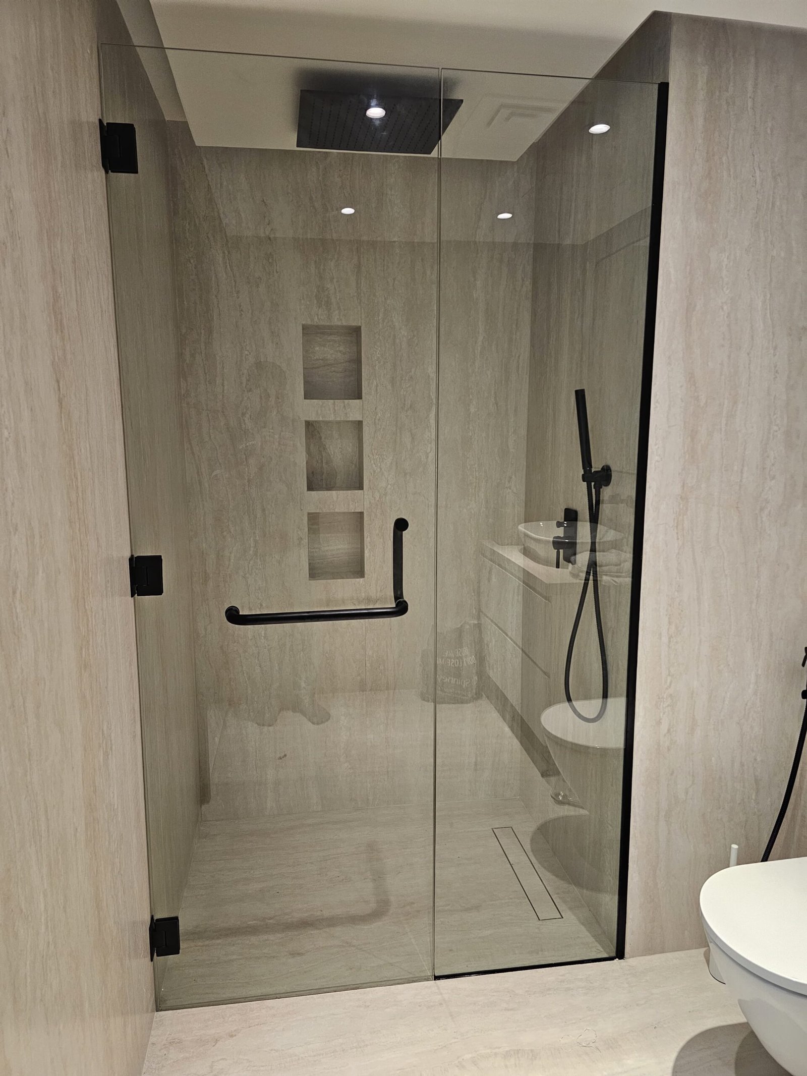 Frameless shower enclosure completed by Crystal Vista